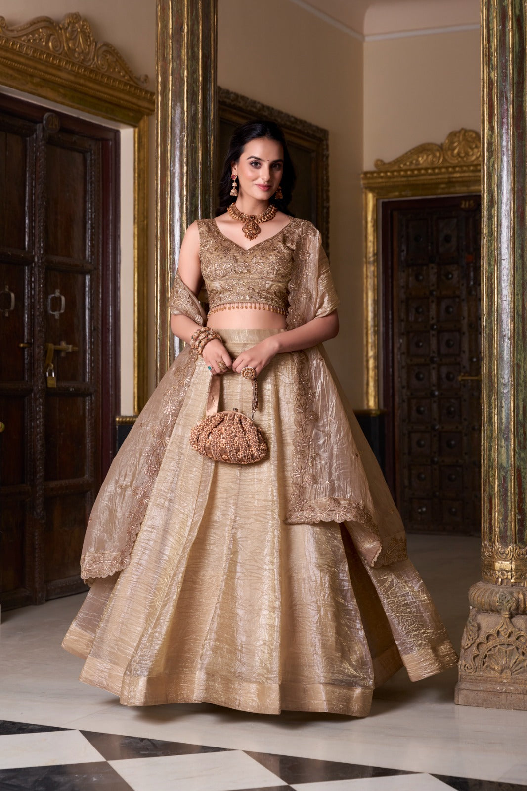 Shop Golden Crushed Lehenga Choli by FEALDEAL. Designer stitched lehenga set with dupatta, ideal for weddings, Navratri & festive celebrations.